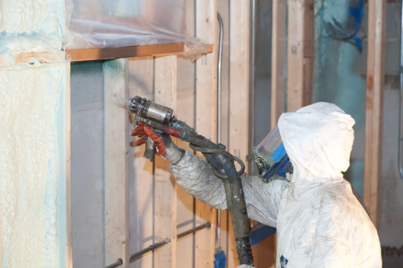 Applying closed-cell spray foam in open wall cavities